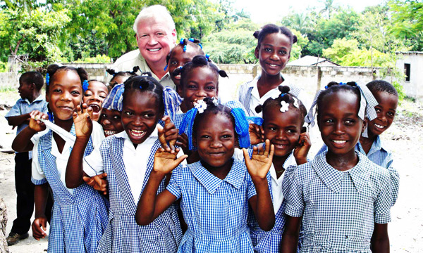 Scott Howard with children in Haiti